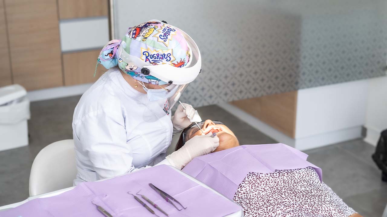 A periodontist in Armenia reviewing a dental X-ray for a gum diagnosis