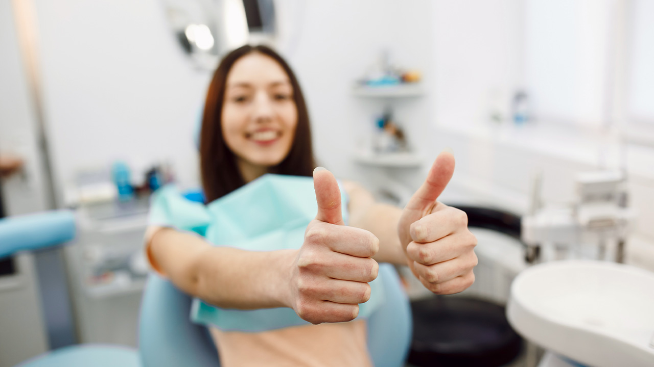 A woman with a positive attitude at the dentist