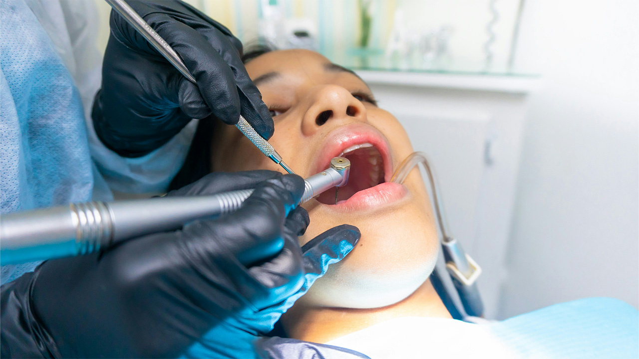 A dentist examining a patient
