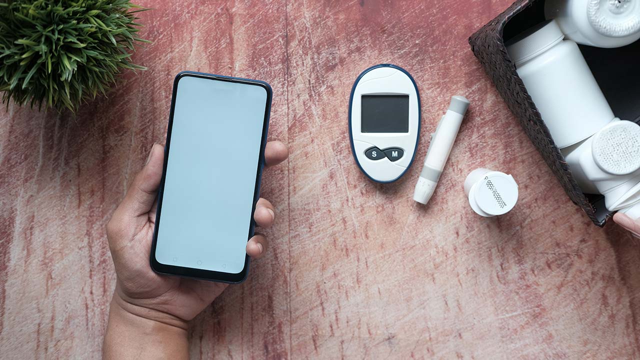 The photo shows a blood monitoring kit for measuring sugar levels and diabetes.