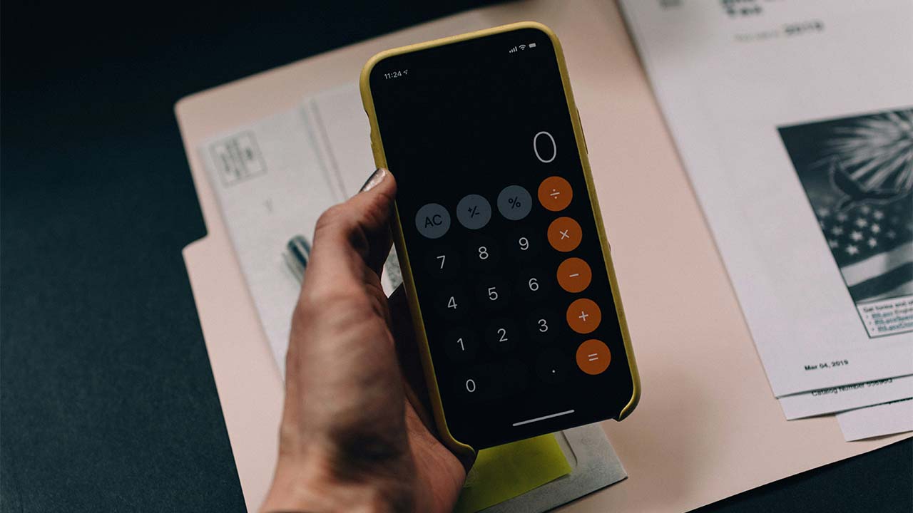 Cell phone with its calculator looking at numbers