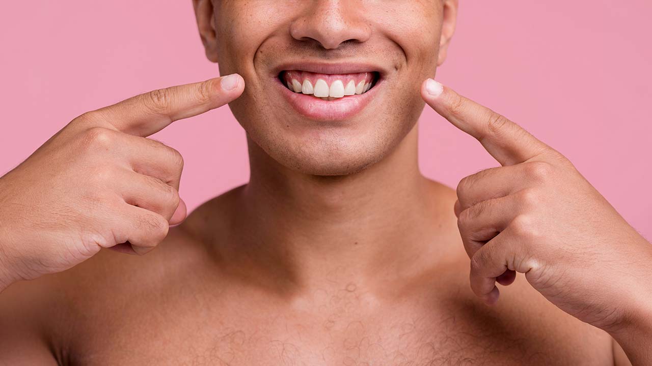 A man showing off his mouth and white teeth in an advertisement for oral care