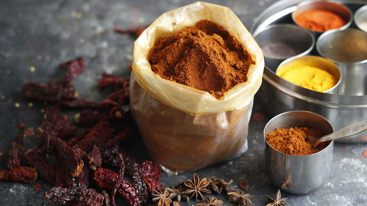 A small bag filled with colorful spices